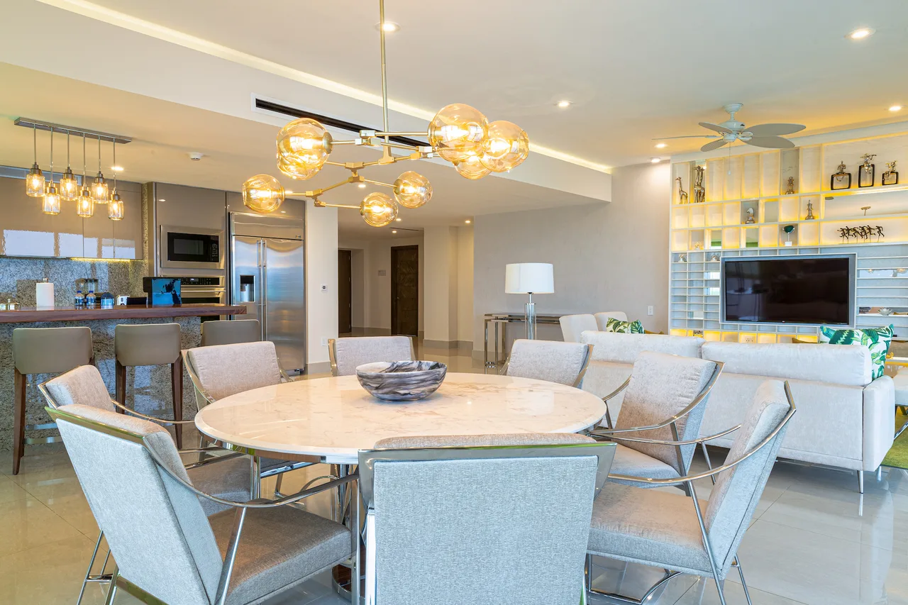 Dining table for eight with the living room beyond