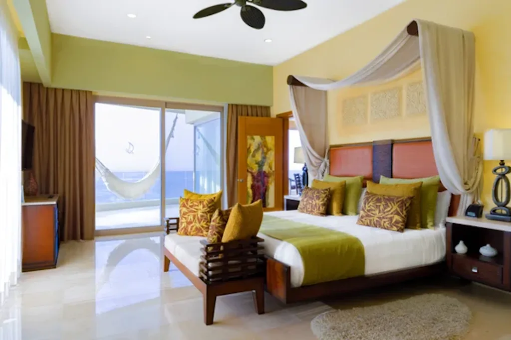 Master bedroom with canopy king bed and terrace hammock